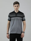 Man wearing a black black casual striped polo t shirt on a light gray background