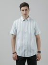 Man wearing a green green striped half sleeve 100% cotton shirt on a light gray background