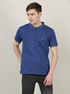 Man wearing a blue dark blue printed casual polo t shirt with casual styling on a gray background