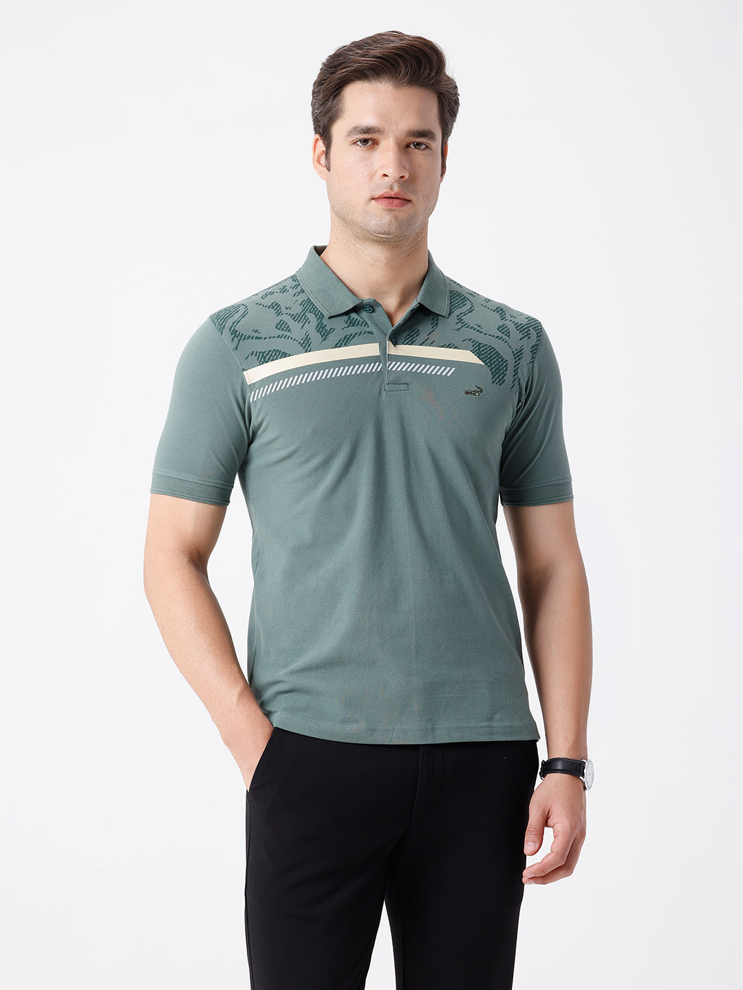 Man wearing a green iceberg green chest print slim fit polo t shirt on a light gray background