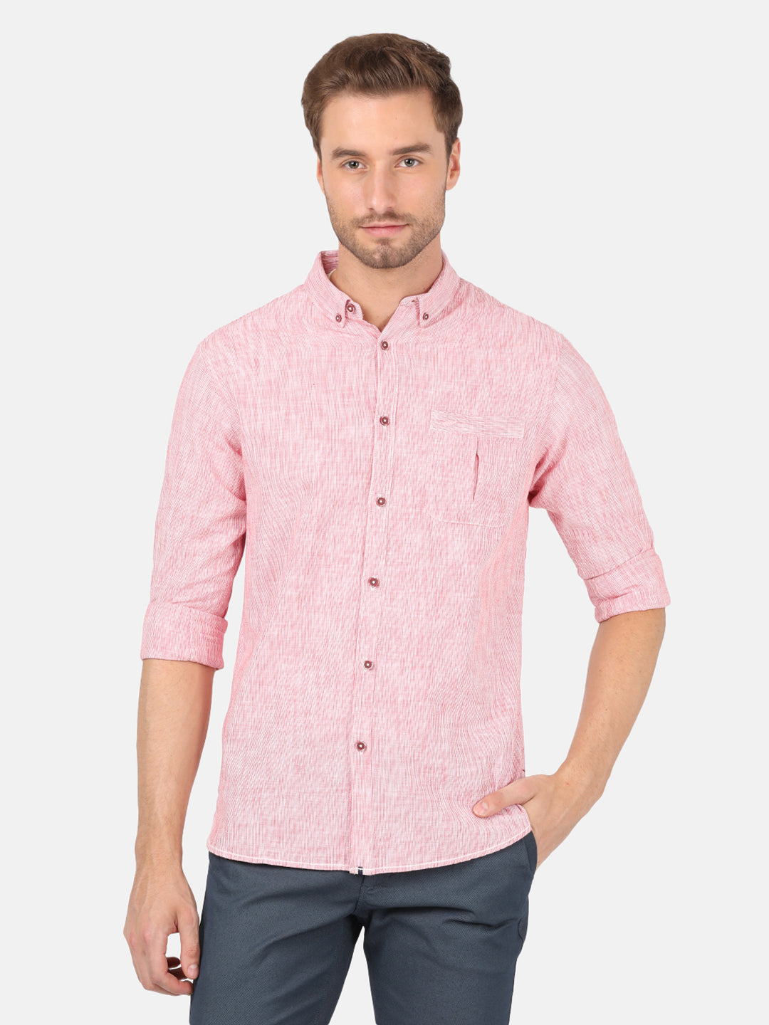 Man wearing a red red striped casual full sleeve 100% cotton shirt on a light gray background
