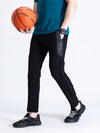 Man wearing a black solid black slim fit track pant with casual styling on a gray background