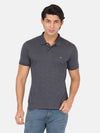 Man wearing a grey dark grey printed casual polo t shirt on a light gray background