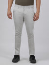 Man wearing a beige solid beige casual trouser with casual styling on a gray background