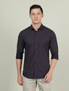Man wearing a navy navy printed casual full sleeve 100% cotton shirt with casual styling on a gray background