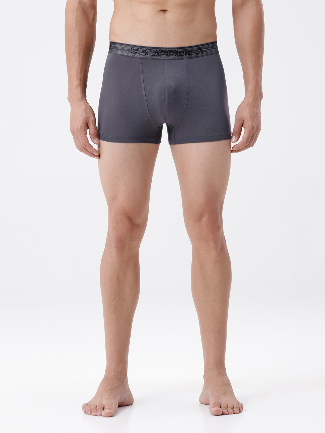 Person wearing gray boxer briefs on a white background