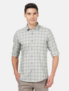 Man wearing a grey light grey checked full sleeve shirt with casual styling on a gray background
