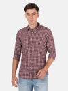Man wearing a maroon checked casual full sleeve shirt with casual styling on a gray background