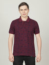 Man wearing a red wine red printed polo t shirt on a light gray background