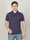Man wearing a blue casual royal blue printed polo t shirt on a light gray background