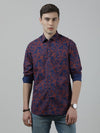 Man wearing a navy navy printed casual full sleeve shirt with casual styling on a gray background