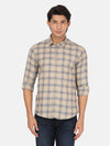 Man wearing a beige beige checked full sleeve shirt on a light gray background