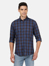 Man wearing a navy casual navy checked full sleeve shirt with casual styling on a gray background