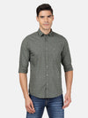 Man wearing a green casual green printed full sleeve 100% cotton shirt with casual styling on a gray background