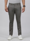 Man wearing a grey casual grey solid trouser on a light gray background