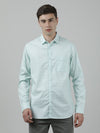 Man wearing a green checked full sleeve green 100% cotton shirt on a light gray background