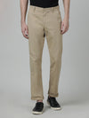 Man wearing a brown khaki brown casual solid slim fit trouser on a light gray background