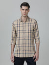 Man wearing a beige beige checked full sleeve 100% cotton shirt with casual styling on a gray background