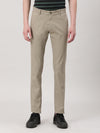 Man wearing a beige printed casual beige trouser with casual styling on a gray background