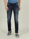 Man wearing a blue dark blue solid mid rise slim fit casual jean on a light gray background