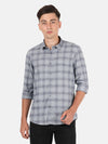 Man wearing a grey dark grey checked casual full sleeve shirt on a light gray background