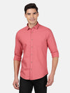 Man wearing a red coral red solid full sleeve 100% cotton shirt with casual styling on a gray background