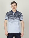 Man wearing a blue ice blue printed polo t shirt with casual styling on a gray background