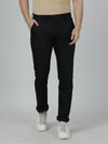 Man wearing a black black solid casual slim fit trouser on a light gray background