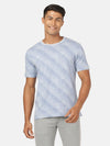 Man wearing a blue light blue printed slim fit t shirt with casual styling on a gray background