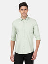 Man wearing a green printed green full sleeve 100% cotton shirt with casual styling on a gray background