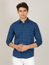 Man wearing a blue printed full sleeve 100% cotton blue shirt with casual styling on a gray background