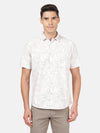 Man wearing a brown brown printed half sleeve 100% cotton casual shirt with casual styling on a gray background