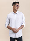Man wearing a luxury soft purple stripe fluid shirt on a light gray background