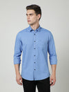 Man wearing a blue blue solid full sleeve shirt on a light gray background