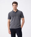 Man wearing a grey birds eye engineered stripe polo grey with casual styling on a gray background