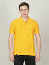 Man wearing a yellow casual yellow printed polo t shirt with casual styling on a gray background