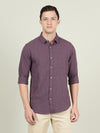 Man wearing a purple solid full sleeve 100% cotton shirt on a light gray background