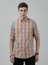 Man wearing a orange striped full sleeve 100% cotton shirt with casual styling on a gray background