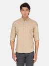 Man wearing a brown brown printed full sleeve shirt with casual styling on a gray background