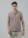 Man wearing a brown coffee brown printed polo t shirt with casual styling on a gray background