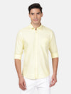 Man wearing a yellow yellow solid casual full sleeve 100% cotton shirt on a light gray background