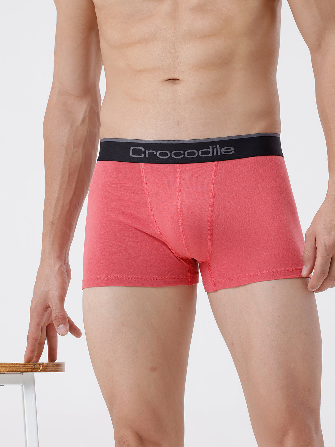Red boxer briefs with black waistband featuring 'Crocodile' brand on a plain background