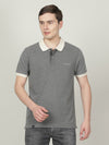 Man wearing a grey charcoal melange grey solid casual polo t shirt on a light gray background