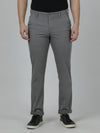 Man wearing a grey dark grey casual solid slim fit trouser on a light gray background