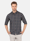 Man wearing a blue vintage blue checked full sleeve shirt on a light gray background