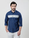 Man wearing a navy navy striped full sleeve 100% cotton shirt on a light gray background