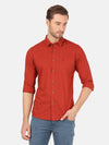 Man wearing a red brick red printed full sleeve shirt with casual styling on a gray background
