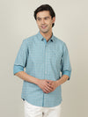 Man wearing a blue light blue printed casual full sleeve 100% cotton shirt with casual styling on a gray background