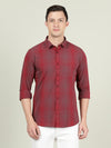 Man wearing a red red checked casual full sleeve 100% cotton shirt on a light gray background