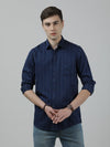 Man wearing a navy navy striped casual full sleeve 100% cotton shirt on a light gray background